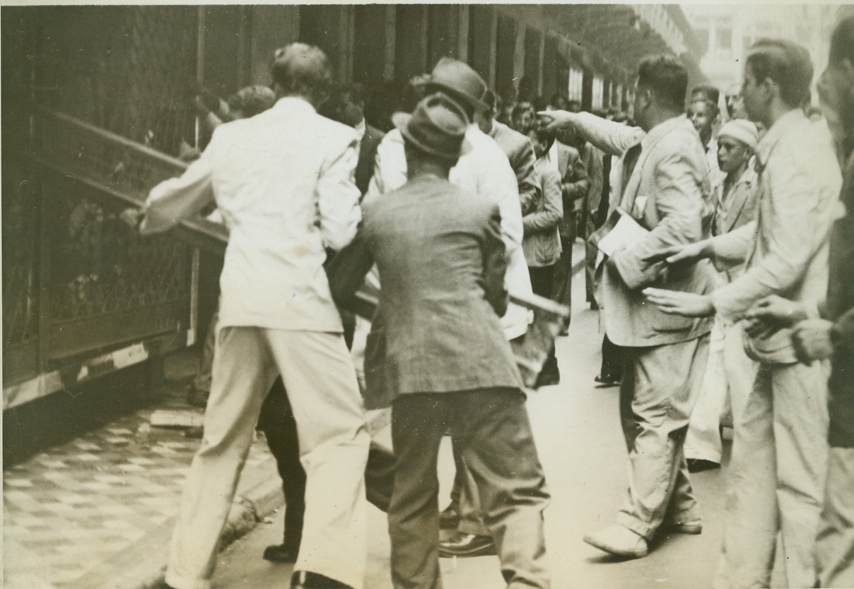 AXIS STORES SMASHED BY RIO DEMONSTRATORS, 3/19/1942. RIO DE JANEIRO – The “Cariocans,” as super-patriots in Rio de Janeiro call themselves, strongly resented the sinking of Brazilian ships by Axis warcraft, and so they took the law into their own hands, March 12, and smashed German stores and other Axis establishments. Here, a crowd of the demonstrators is shown as it smashed windows in the Case Alema, a German department store. Credit: ACME;