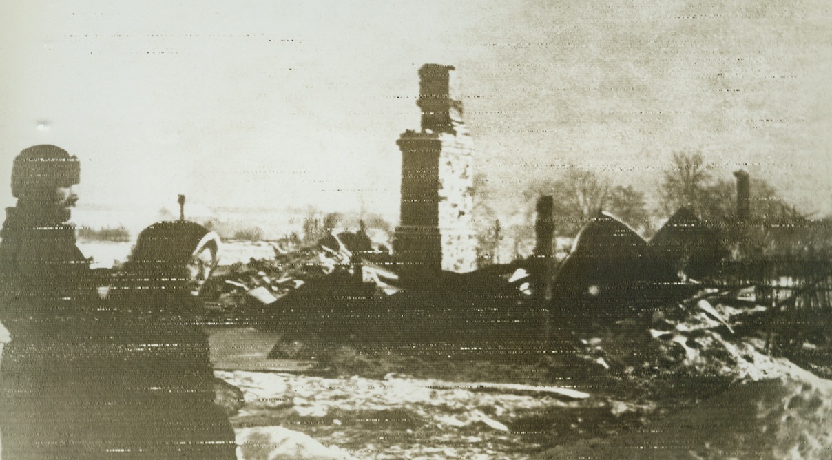 WORK OF RETREATING GERMAN ARMY IN RUSSIA, 3/8/1942. RUSSIA—A soviet peasant couple stand before the ruins of their home, destroyed when retreating Germans fired the village. Radiophoto was flashed to New York from Moscow today. Credit: ACME RADIOPHOTO;