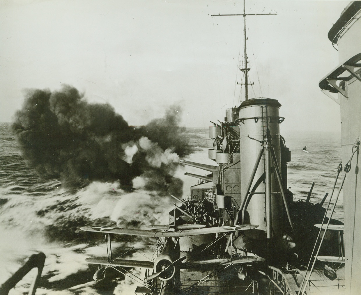 U.S. Cruiser Bombarding Wake Island, 3/25/1942. A United States Pacific fleet task force carried out a surprise attack on Japanese occupied Wake Island on Feb. 24th, smashing shore installations sinking two patrol boats and demolishing 3 large seaplanes.  The U.S. Navy announced in Washington on March 25th.  The above photo released simultaneously by the Navy shows a U.S. cruiser as her main battery bombarded the Jap forces on Wake island as anti-aircraft crews stand by. Credit line (U.S. Navy official photo from ACME);