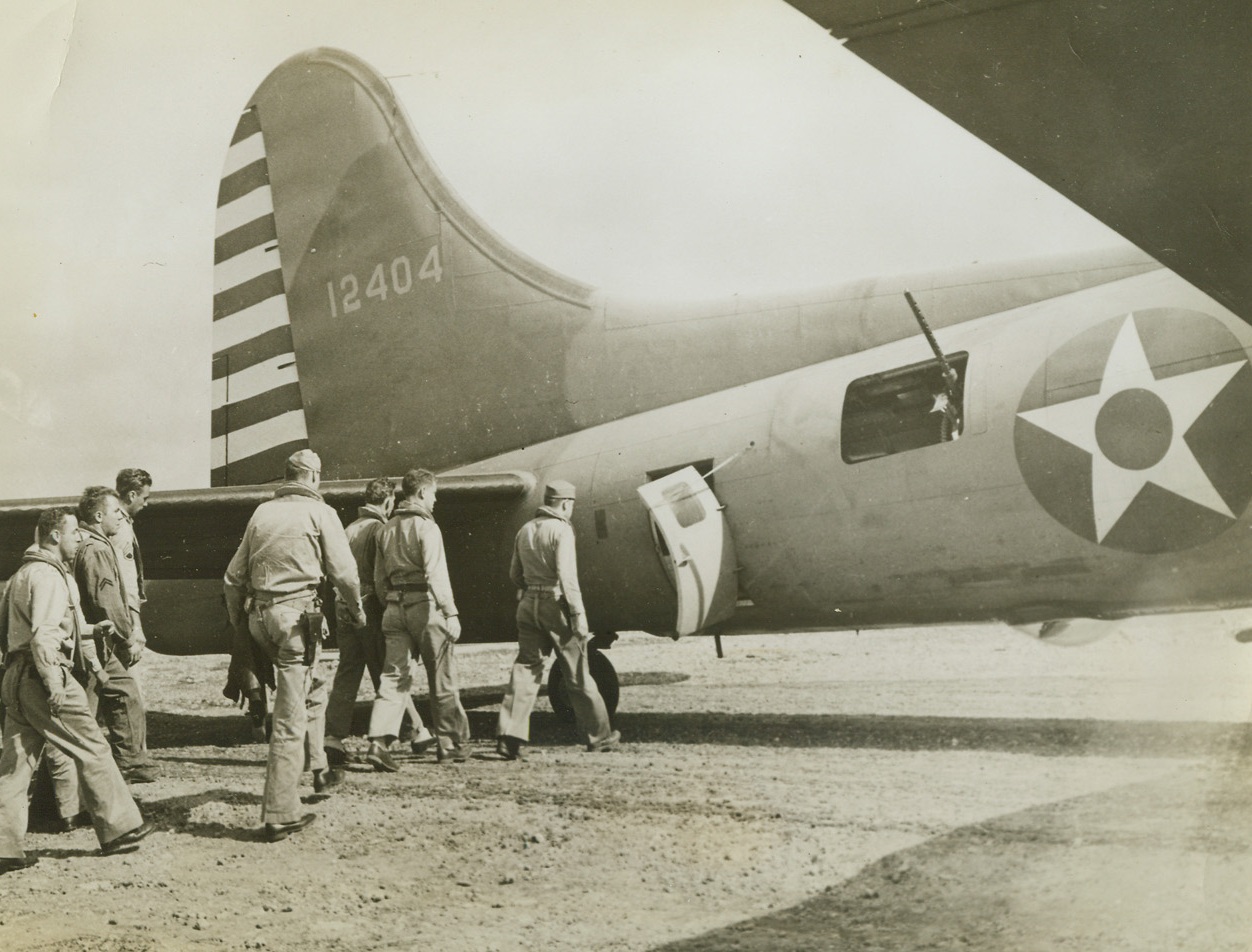 Ready for Takeoff, 3/7/1942. Hawaii—The crew of a Flying Fortress of the Hawaiian Air Force Bomber Command board their plane as they prepare to take off on a patrol flight.Credit: ACME.;