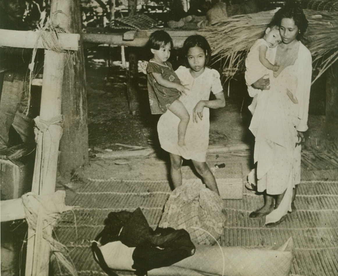BATAAN PENINSULA REFUGEES, 4/9/1942. This picture, one of the latest to be received from the Bataan Peninsula, shows innocent victims of the war, as they prepared to evacuate their homes, “somewhere in Bataan.” Credit: U.S. Army Signal Corps photo from Acme;