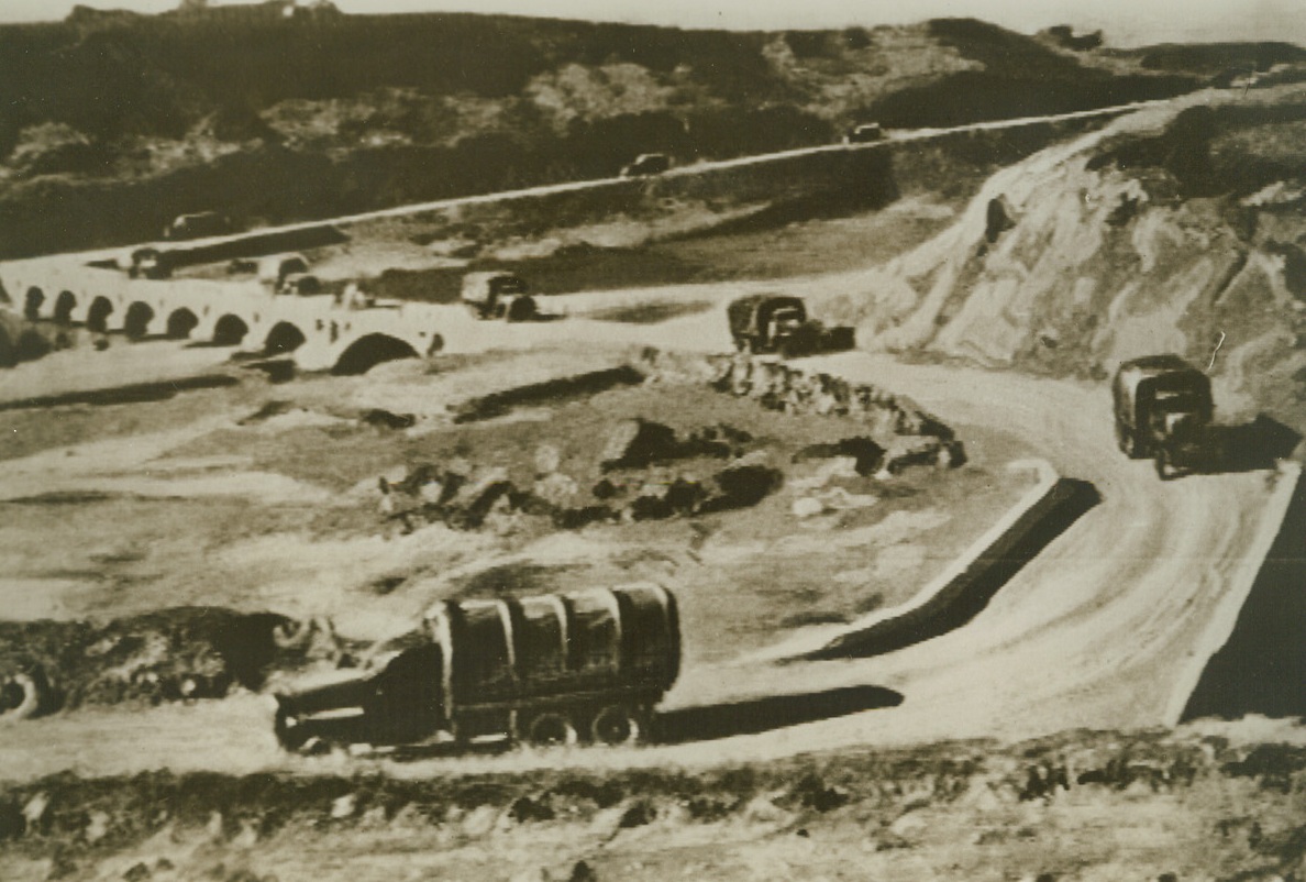 Speeding Supplies to Russian Ally, 5/14/1942. Lorries loaded with supplies from the United States and Great Britain are shown, in this photo radioed from London to New York today (May 14), in “convoy” as the trucks are rushed toward Russia. Over this new road, built with cooperation of government of Iran, the trucks travel for eight days en route to the Soviet Republics. Credit: ACME Radiophoto;
