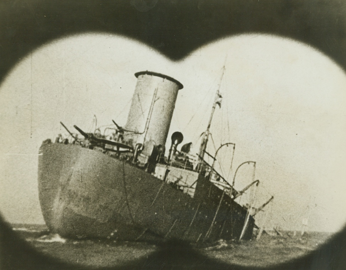 Did “Coming Events Cast Their Shadow?”, 5/14/1942. In Northeastern Canada—When the Columbia picture, “The Invaders,” was first shown in the United States, portraying the invasion of North America, through Canada, that invasion was only a possibility. But on May 12th, when Canadian Navy Minister Angus McDonald announced that two ships had been torpedoed in the St. Lawrence River, near its mouth, some of the scenes from “The Invaders” were brought vividly to mind. Is it possible, people are now asking, that other scenes from the movie may come to pass? Here, from the picture, is a freighter, as it is just about to plunge to the bottom—the victim of an Axis torpedo. It may very well be a picture of one of the two vessels sunk in the St. Lawrence. Credit: ACME.;