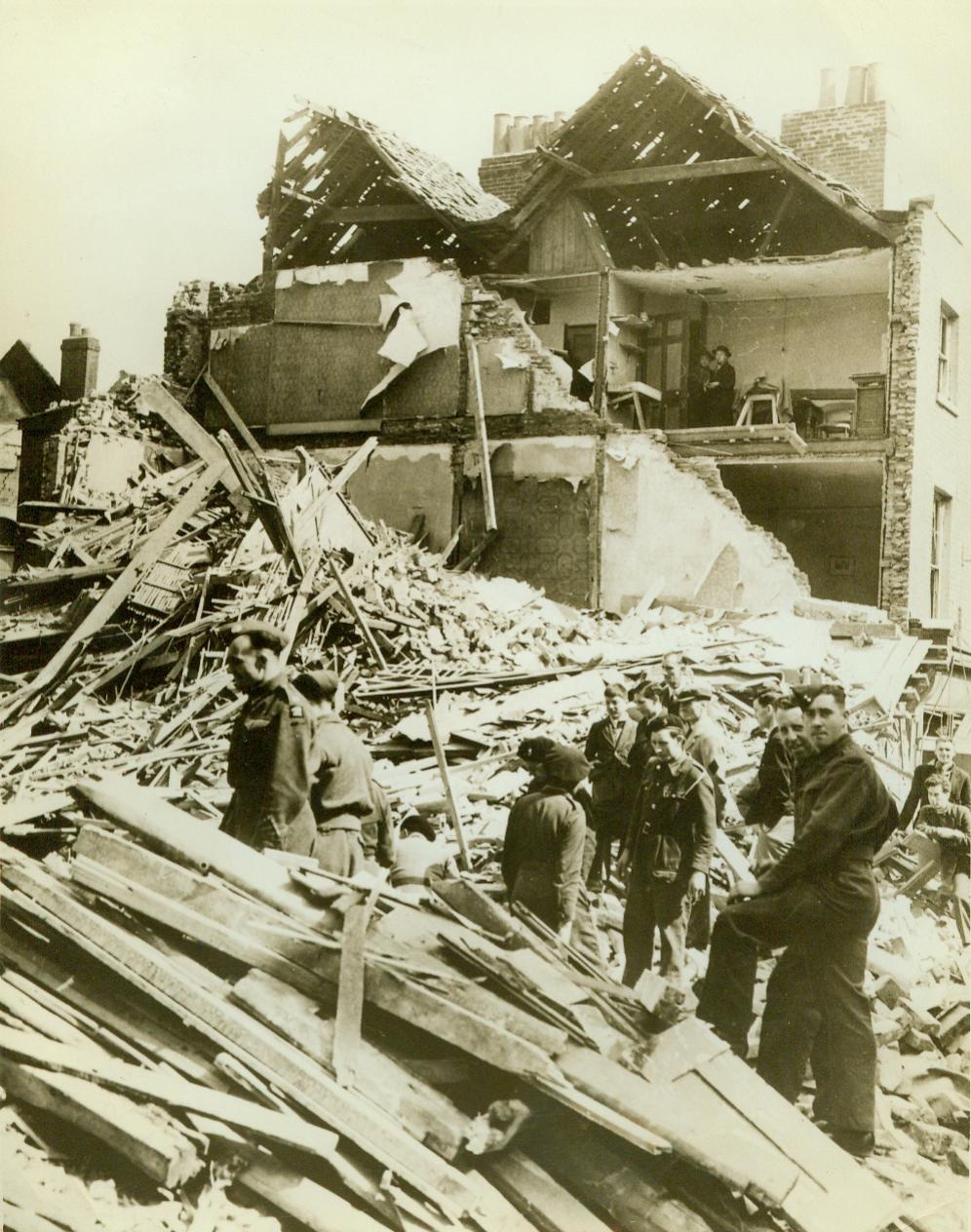 The new order visits Canterbury, 6/9/1942. CANTERBURY, ENGLAND - A pile of rubble is all that remains of these shops and dwellings in old Canterbury, bombed by the Nazis as a reprisal for the R.A.F.'s great attack on Cologne.; Credit line (ACME);