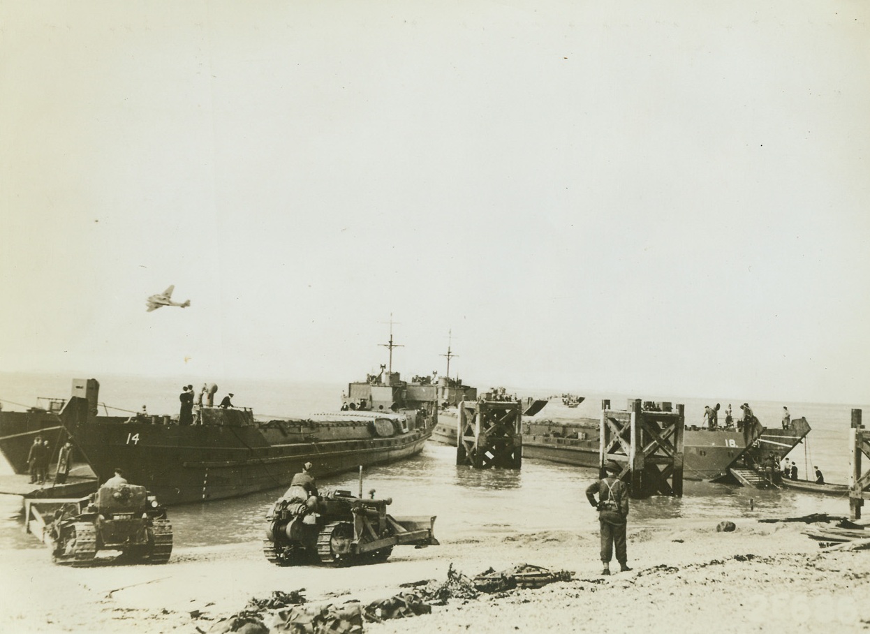 Tank Carriers Land After Dieppe Raid, 8/27/1943. England – Two of the United Nations tank landing craft, used for the first time during the huge Commando-Ranger raid on Dieppe, August 19, as they were beached “somewhere in Britain,” following the raid. Credit: U.S.A. Signal Corps Photo from ACME;