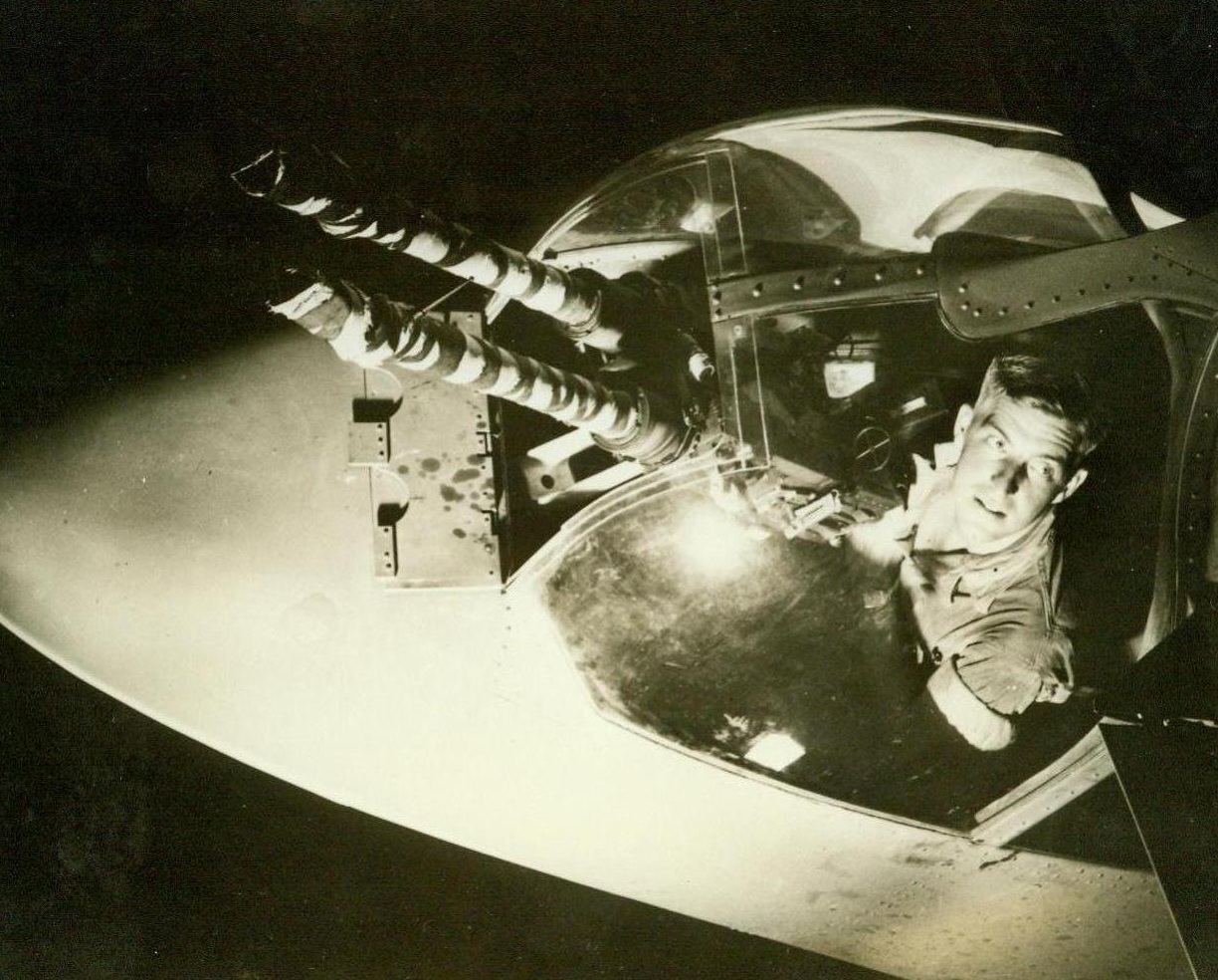 Itching Fingers, 8/14/1942. Macdill Field, Fla. – In wide-eyed alertness, the tail gunner of a B-26 scans the skies for the first sign of enemy opposition. He’s the man who holds the life of his flying teammates and the safety of his plane in his trigger fingers when the going gets toughest. His job calls for split-second timing in beating the foe to the punch. This gunner is an anonymous member of an operational training crew learning the finer points of his deadly art. The wrappings protect guns from weather. They come off when the plane goes into combat duty. 8/14/42 (U.S. Army Air Forces Photo From ACME);