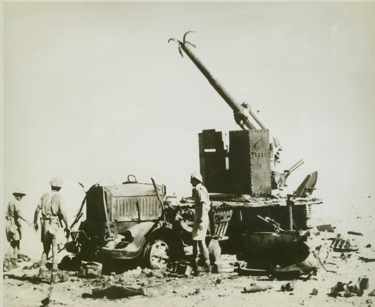 END OF AN “EIGHTY-EIGHT”, 8/7/1942. EGYPT – No more shots will be fired from this 88-mm. German anti-tank which was wrecked by high explosive shells fired by New Zealand 25-pound field guns. Rommel’s men blew up the muzzle before abandoning the gun. (Photo released by New Zealand Legation) Credit: ACME;
