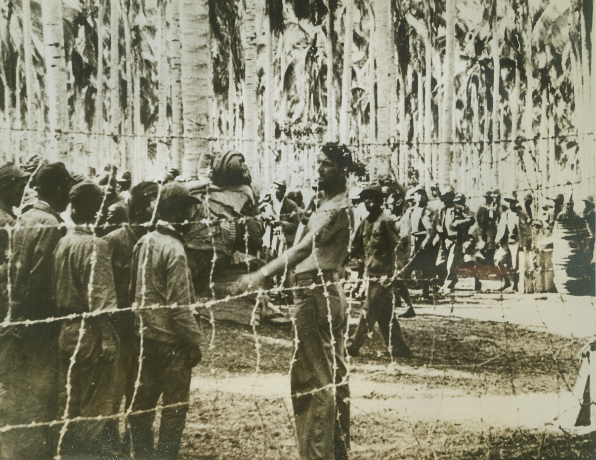 Captured “Nip” Workmen, 9/22/1942. Guadalcanal, Solomon Islands – This band of Japanese workmen, penned in behind barbed wire, was captured by U.S. Marines during the recent heavy fighting on Guadalcanal Island.  The “Nips” had been brought from Japan to construct bases on the island. Credit line (ACME);
