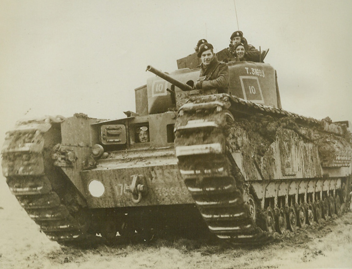 Churchill’s Namesake, 9/28/1942. England—Britain’s new infantry tank, shown here on maneuvers, is called the “Churchill.” It is so heavily armored that it can be used as a pill-box, has 6-pounder guns, and can move along at a startling speed. (Passed by censor). Credit: Official British photo from ACME.;