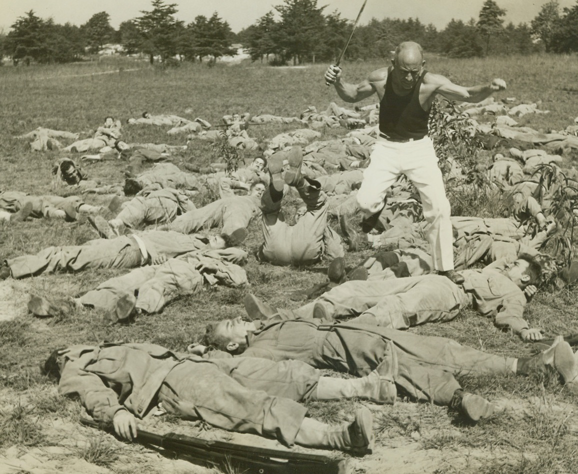 Potential Rangers Undergo Training, 9/25/1942. Fort George G. Meade, MD.—Under the instruction of Major Francois D’Eliscu (above), numbers of American soldiers are undergoing training in preparation for Ranger attacks on our enemy. Here the Major charges over some of the trainees to harden them for future duty.Credit: ACME.;