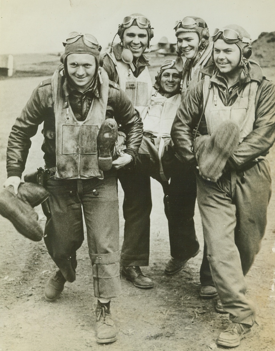 Flying Tigers in Alaska, 9/15/1942. Kiska, Alaska—A squadron of “Flying Tigers” has been formed in Alaska under the command of Major John Chennault, son of General Chennault, leader of the famed “Flying Tigers” in China. Here, members of Major Chennault’s “Flying Tigers” gave one of their buddies a boisterous accolade for shooting down a Jap dive bomber—maybe he shoulda stood in his plane. Left to right: Lt. H.B. Barnard; Lt. M.J. Buku; Lt. W.E. Brinkeman; Lt. R. Dale; and Lt. M.S. Fetz.Credit: Army Signalcorps photo from ACME.;