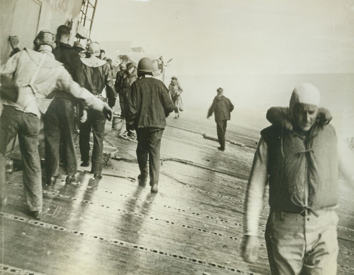 They’ll Remember the Yorktown, 9/16/1942. Washington, D.C. – Saddened crew members cautiously walk the sloping decks of their ship, the U.S.S. Yorktown—already listing toward the sea which marks her grave—after it was battered by a hail of Jap bombs and torpedos during the height of the battle of Midway island.  The 19,900-ton flat-top finally sank on June 7th, but these men who saw their ship go down will remember –They’ll give the Japs reason to remember!  The Japs got the veteran aircraft carrier, but only after it had been in at the death of at least a dozen Jap ships, and had played a major role in turning back the Japanese armada from an attempted invasions of Midway island and the Hawaiians.Credit Line (Official U.S. Navy photo from ACME);