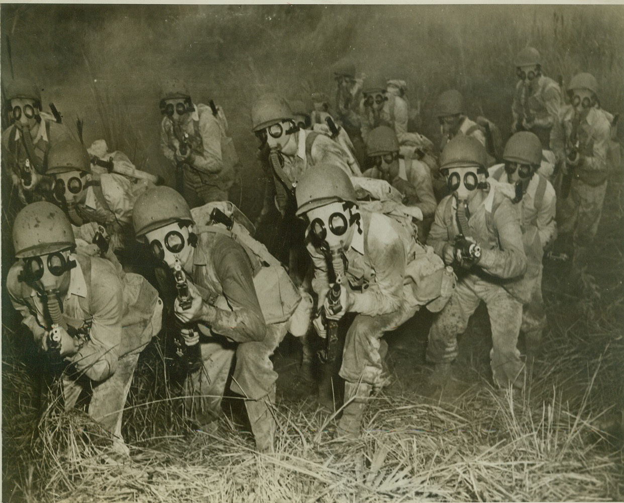 “Bushmasters” on Maneuvers, 9/29/1942. CARIBBEAN DEFENSE AREA – Members of a crack U.S. Army jungle-fighting unit, the “Bushmasters” as they maneuver through a simulated gas attack. These men, highly-trained and tough, are the spearhead of the attack forces under Lt. Gen. Frank M. Andrews, Chief of the Caribbean Defense Area. Credit: (U.S. Army Photo from ACME);