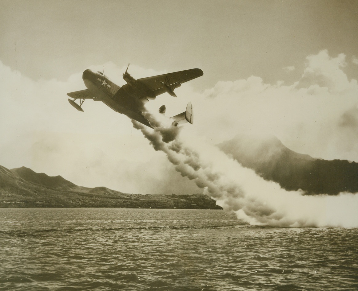 Jet-Propelled Take-off for Mariner, 11/9/1944. South Pacific – As the massive, bi-motored Martin mariner rises into the air, streams of smoke are ejected from the rockets situated under the wings.  Jet propulsion is being more and more widely used to assist in speedy take-offs for more cumbersome planes.  This picture was taken at a Pacific base by the new power-driven, portable K-25 camera.Credit (Official US Navy photo taken from ACME);