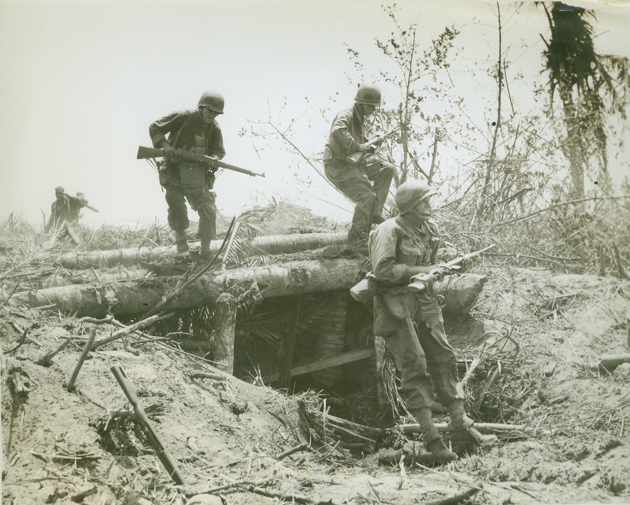 Speedy Jap-Hunters, 11/1/1944. Leyte, Philippines—Fast-stepping 96th division infantrymen speedily put ground between themselves and the landing beaches as they hurry after the Japs in the initial hours of the Leyte invasion. Photo by ACME photographer Stanley Troutman for the war picture pool. Credit: ACME.;