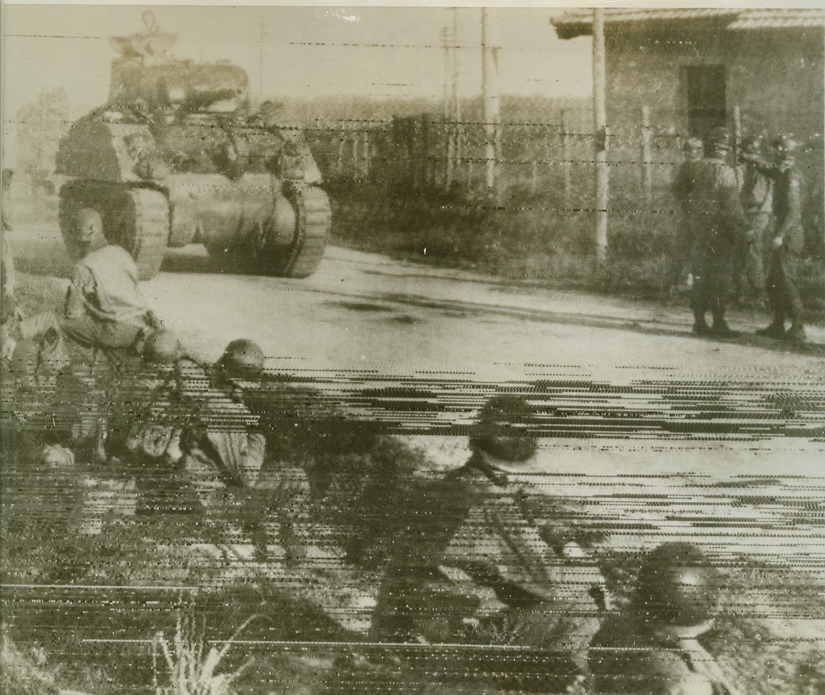 5th Army Tank Heads for Rome, 1/26/1944. Nettuno, Italy – A 5th Army tank rolls inland along the new “Road to Rome” as men, equipment and supplies pour ashore almost unopposed at Allied bridgeheads south of Rome. This photo, taken near Nettuno, was flashed to New York by radio tonight. Credit: (Stars and Stripes photo thru OWI Radiophoto from ACME);