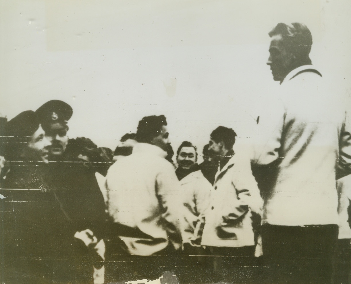 Scharnhorst Survives, 1/3/1944. Just plucked out of the sea by the crew of H.M.S. Duke of York, these Nazi sailors (center, hatless) don’t look very mournful over the loss of their ship, the German battleship Scharnhorst. They are among the very few Nazi seaman who survived the shelling, torpedoing and sinking of the Vessel. Photo radioed to New York from London today, January 3, 1944. Credit: ACME RADIOPHOTO.;