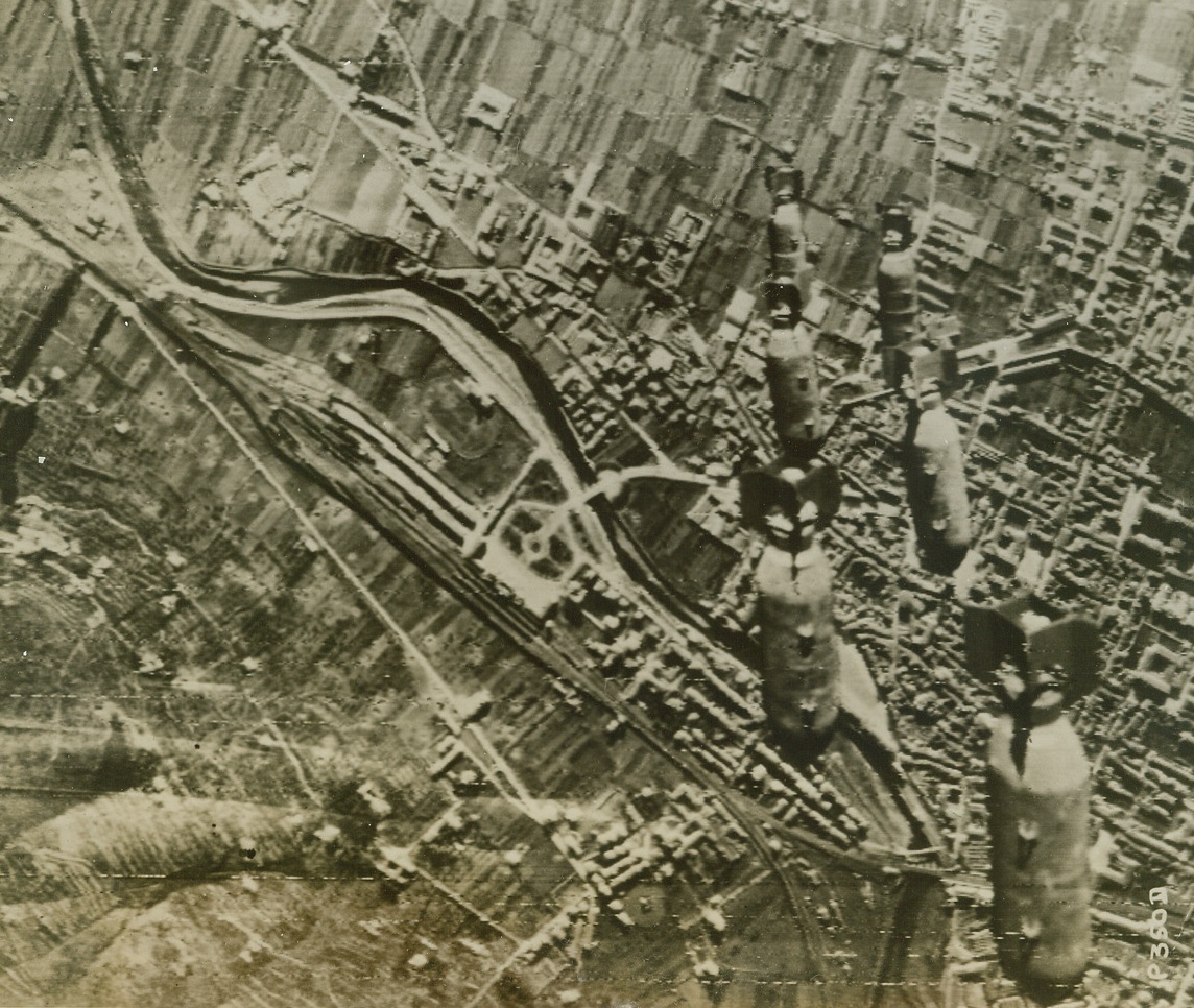 Bombs Away, 1/5/1944. PRATO, ITALY—Hurtling through Italian skies, the bombs from American B-26 medium bombers raiding Prato zooms toward that town’s marshalling yards. A few moment’s later, as our explosives found their Axis target, smoke and flame covered the entire area. Credit: SIGNAL CORPS RADIOTELEPHOTO from ACME.;