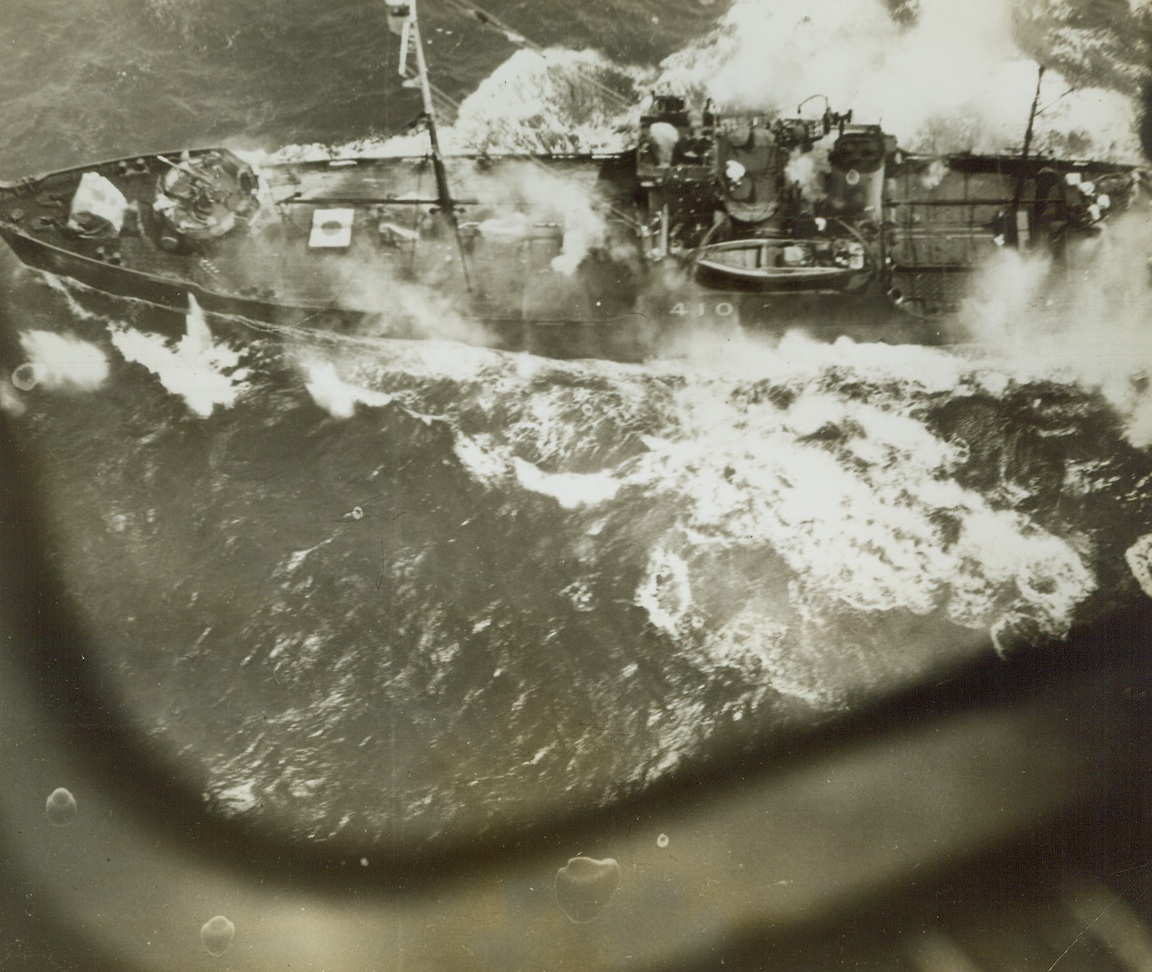 Carrier Downs Jap Torpedo Plane, 1/1/1944. A billowing cloud of smoke marks the grave of a Japanese torpedo plane, brought down by the ack-ack fire of a U.S. Navy carrier. The vessel, of the 25,000-ton Essex class, was attacked by low-flying Jap torpedo planes, after the U.S. raid on the Marshalls on December 4, 1943. Credit: U.S. Navy photo from ACME;