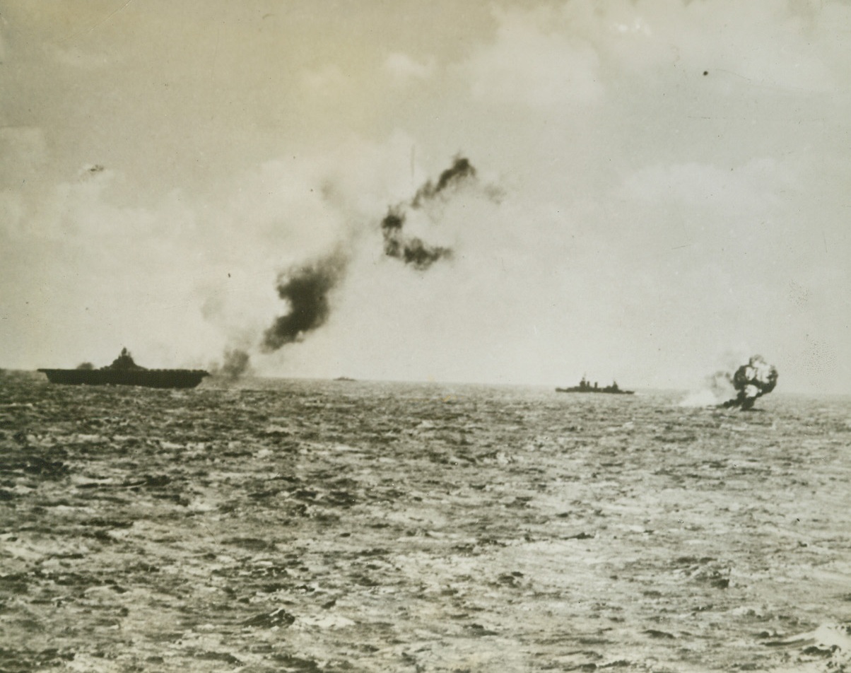 Attack on Jap Cargo Ship, 1/1/1944. A Navy photo-reconnaissance plane returned to its base with this photo as evidence of its attack on a Jap cargo ship in the Marshall Island area.  Only 100 feet above the hull and carrying no bombs, the Liberator riddled the freighted with 50 caliber guns.  Note that the forward gun of the vessel is not manned, indicating that the plane caught the crew by surprise.Credit Line (Official U.S. Navy photo from ACME);
