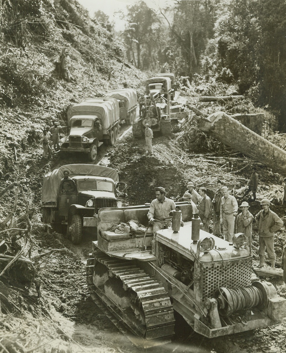 Inexperienced Drivers Need Not Apply, 1/25/1944. Burma – The lead car of a convoy bogs down on what drivers call a “tough spot” on the Ledo supply road to China, and a caterpillar comes to the rescue of the caravan.   The bumpy, twisty road is being built by American engineers, and up to now it is a “dead end” trail with Japs as a road block.Credit (ACME photo by Frank Cancellare, War Pool Correspondent);