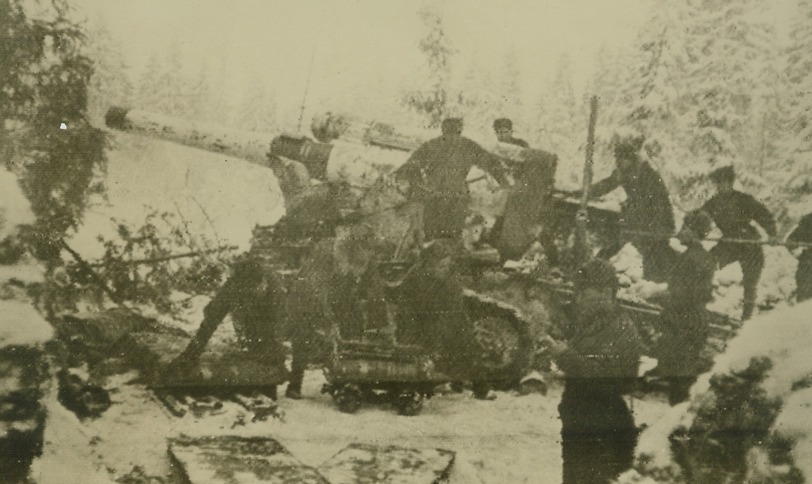 Shelling Nazis, 1/17/1944. ON THE RUSSIAN FRONT—Shelling enemy communication lines, a heavy Soviet gun makes things hot for the Nazis in the Vitebsk area, as the Russians fight in a snowbound forest. Photo radioed to New York today (January 17th) from Moscow.Credit: ACME Radiophoto;
