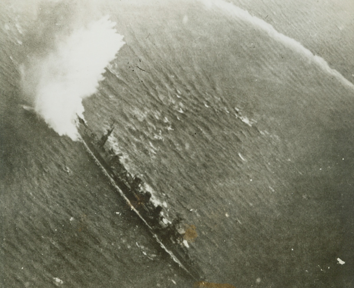 Death Dance of a Jap Cruiser, 1/28/1944. Marshall Islands – Round and round she goes, with the white line at the right marking her swirling wake, but a Yank torpedo gets the Jap cruiser with a clean hit.  A Grumman avenger released the tin fish that sank the wildly-maneuvering enemy ship at Kwajalein Atoll in the Marshalls, December 4, where a U.S. Navy task force left death and destruction. Credit (Official U.S. Navy photo from ACME);