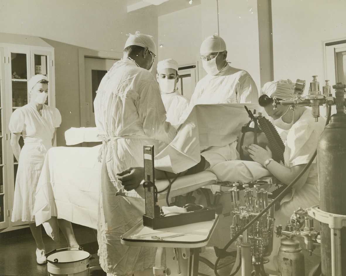 Skilled Surgeons and Soldiers in Palm Beach, 1/31/1944. Palm Beach. Fla.—A wounded soldier undergoes an operation at the Ream General Hospital, former breakers hotel which since last September has been an Army medical center specializing in neuro-psychiatric surgery and facial surgery. At present, about 800 men are being treated there, and the Army had considered wide expansion of accommodations until negotiations were started to return the hotel to its original owners, apparently at the instigation of local real estate and  business interests. Credit: ACME.;