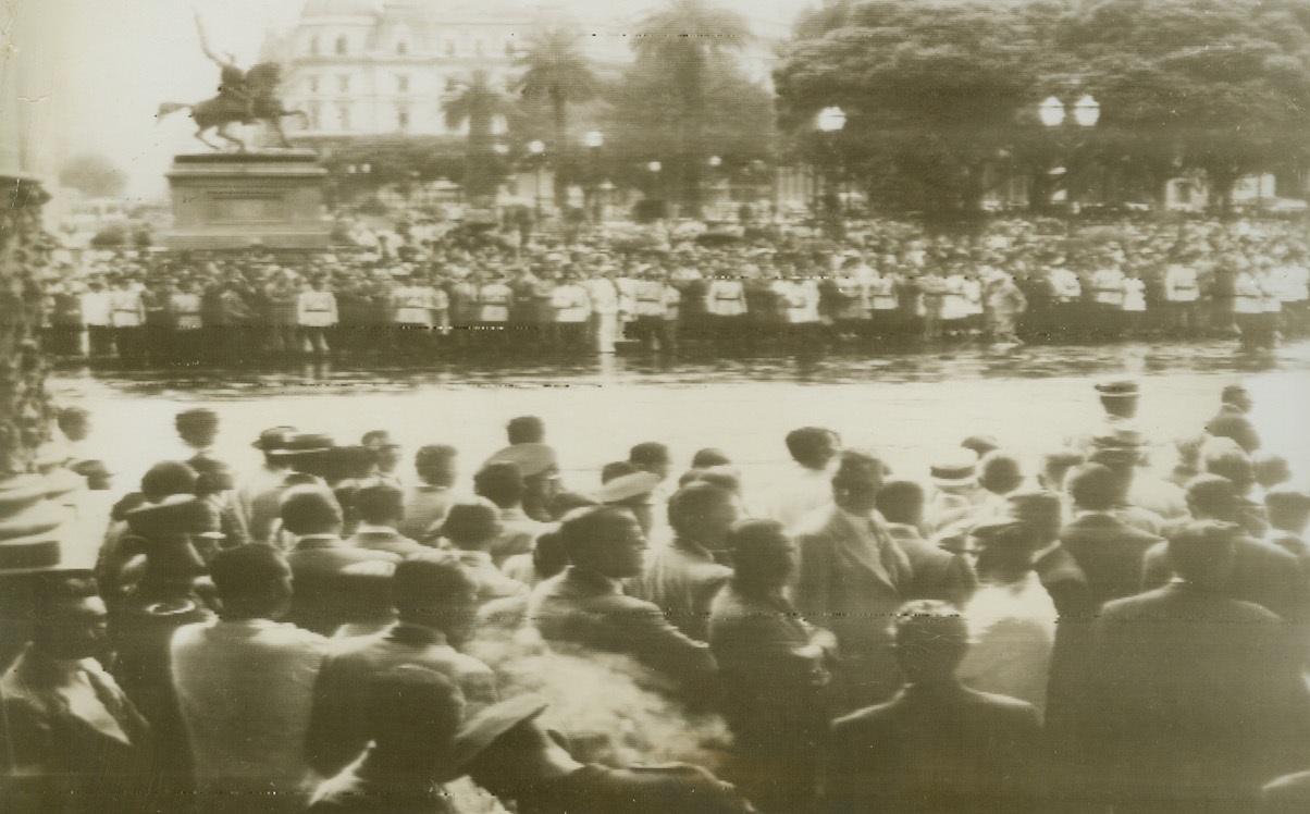 Thousands Hear Ramirez Speech, 1/26/1944. Buenos Aires, Argentina—In spite of the pouring rain, thousands gather in the Plaza de Mayo in front of the Casa Rosada in Buenos Aires to hear President Ramirez announce that Argentina had several relations with the Axis. The address was broadcast over a nation-wide radio hook-up. Photo radioed to New York from Buenos Aires today (January 26th).Credit: ACME radiophoto.;