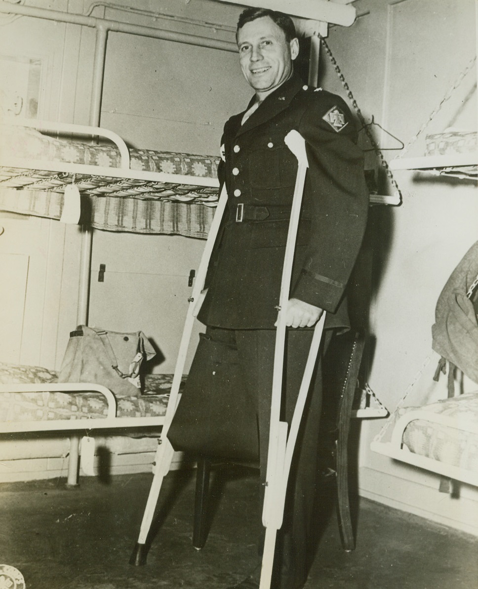 Wounded General Returns, 1/20/1944. An East Coast Port - Brig. Gen. C. M. Ankcorn, of Palouse, Wash., who lost his right leg in front line fighting in Italy while he was still a Colonel commanding a regiment of the 45th Infantry Division, is shown on his return to the United States recently. Gen. Ankcorn lost his leg when a jeep in which he was riding struck a mine in Italy. He has been in the Army since his graduation from Ohio State University in 1917. Credit: U.S. Army photo from ACME;