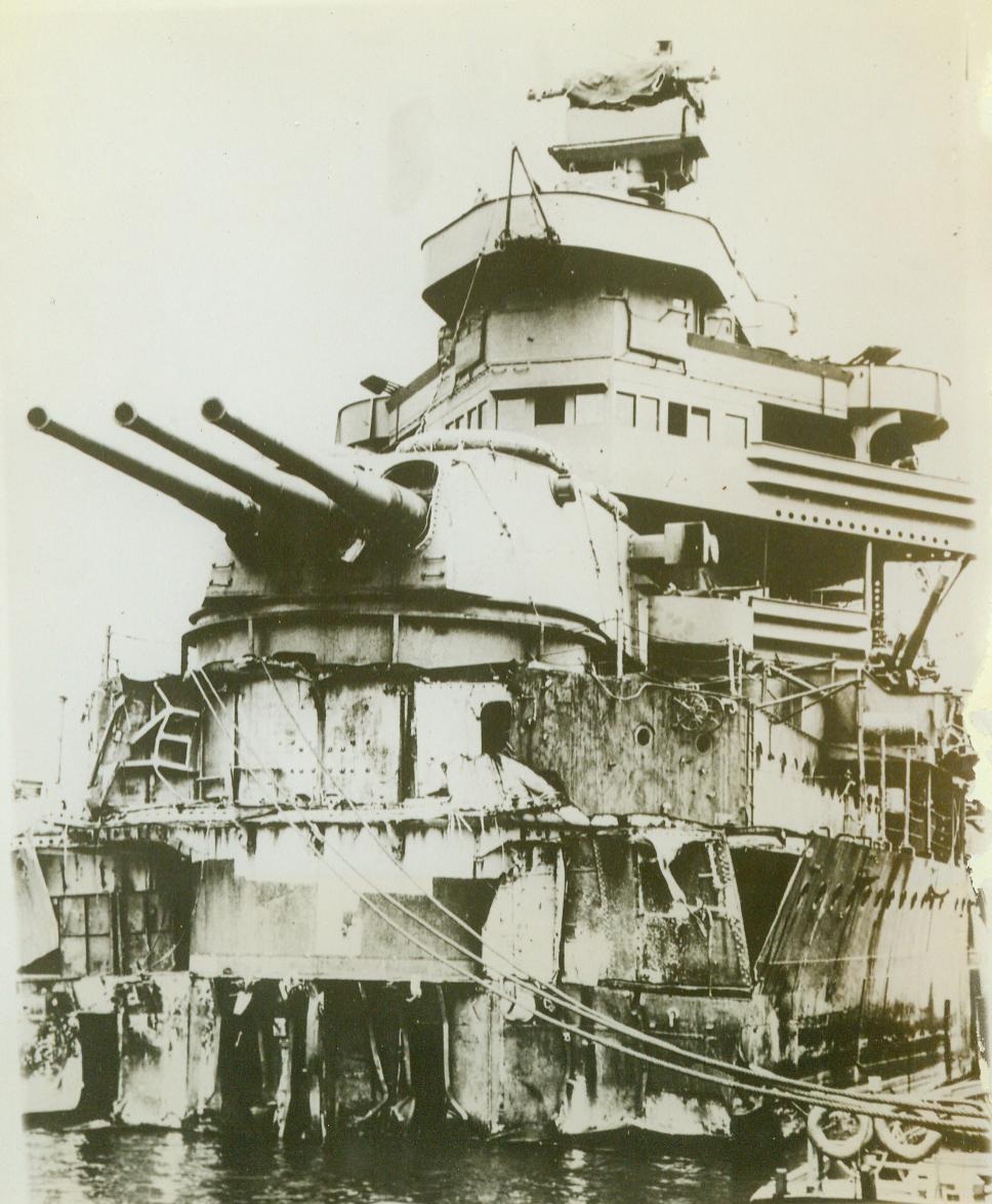 Bow blown off, 1/12/1944. SOUTHWEST PACIFIC – With bow shot off by torpedo blast in southwest Pacific battle with Japs, this U.S. cruiser limped to a Pacific island harbor for repairs and a temporary bow which allowed her to be taken to Pudget Sound Navy Yard, Bremerton Wash. For complete repairs and modernization. Now the cruiser is faster and more deadly than before. CREDIT LINE - U.S. Navy photo from ACME 1/12/44;