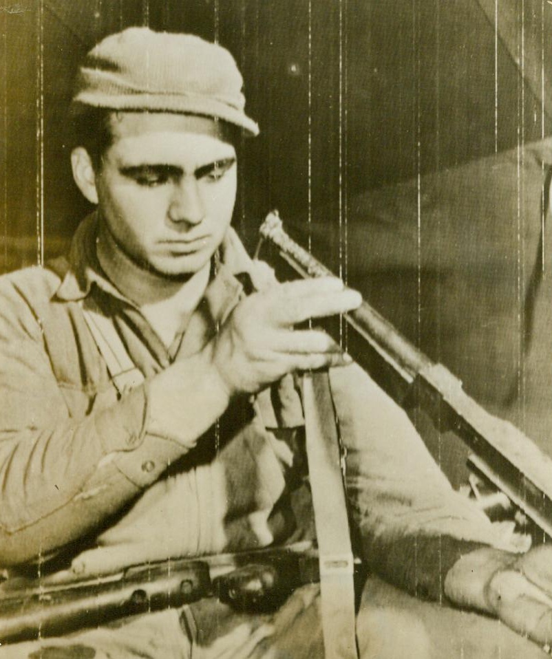 Put twenty-seven Nazis out of action, 1/11/1944. Sgt. Willie B. Slaughter, who lived up to his name and won the DSC, inspects his now-famous “Tommy Gun.” He used the weapon to knock out two Nazi machine guns nexts, kill seven, wounding seven and capturing 13 enemy fighters. CREDIT (U.S. Army Radiotelephoto from ACME) 1/11/44;