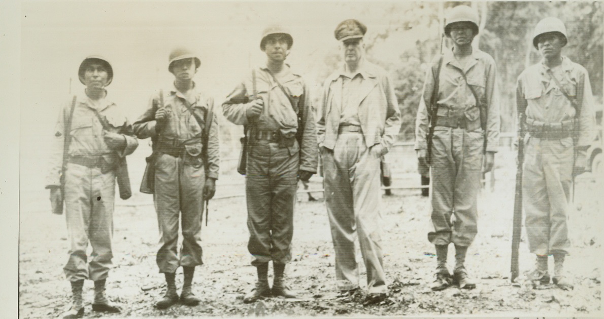 Gen. Douglas Macarthur, 1/19/1944. Gen. Douglas Macarthur, comm-in-chief Allied forces Southwest Pacific area, meets representatives of 5 different American Indian tribes in one U.S. Army unit. Left to right: S/Sgt. Virgil Brown (Pima), Phoenix, Ariz.; Sgt. Virgil F. Howell (Pawnee), Pawnee, Okla.; S/Sgt Alvin J. Viloan (Chitmatcha), Charenton, LA.; General Macarthur; Sgt. Byron L. Tsignine (Navajo), Ft. Defiance, Ariz.; Sgt. Larry L. Dekin (Navajo), Copper Mine Ariz. (U.S. Signal Corps Photo).;