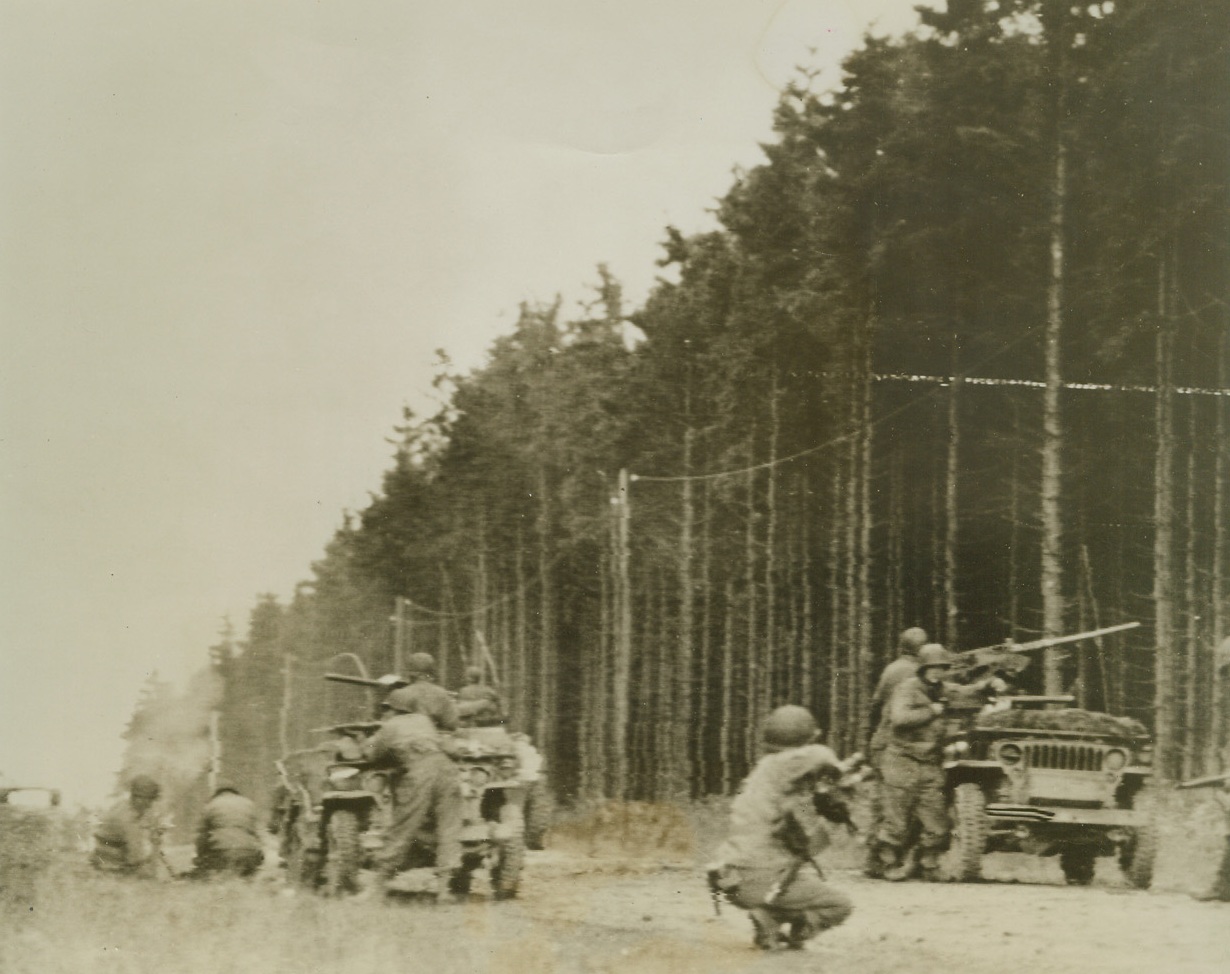 DISHING IT OUT, 10/2/1944. GERMANY—Making things hot for an enemy machine gun nest hidden in the German woods, Yanks send mortar fire screaming into the Nazi position.Credit: Signal Corps Radiotelephoto from Acme;