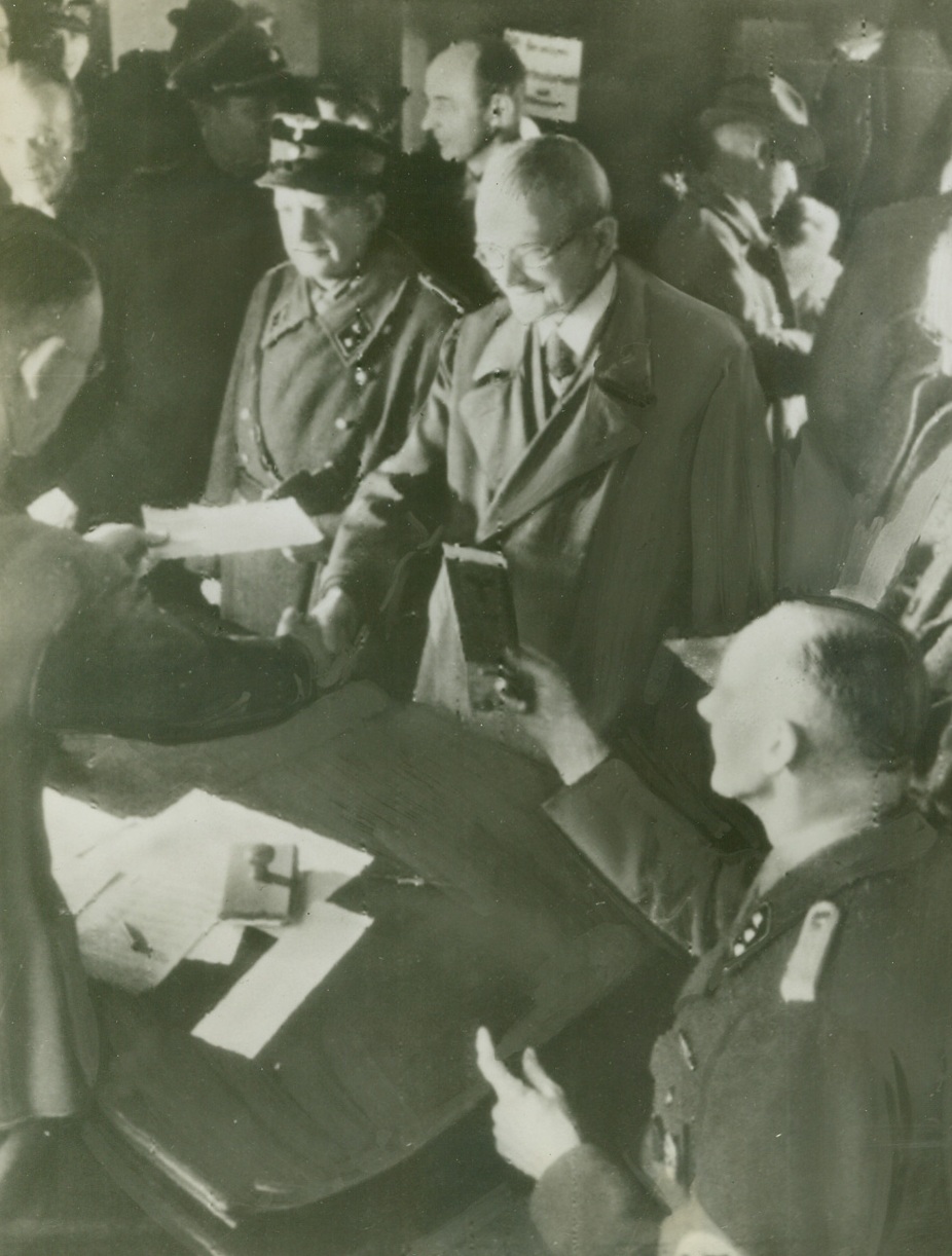 67-YEAR-OLD REGISTERS FOR NAZI ARMY, 10/25/1944. According to the German caption which accompanied this photo, radioed to New York from Stockholm, two elderly German veterans of the first World War are shown registering for service in the new Deutsche Volks-Sturm. Man at center right is sixty-seven years old. Credit: Acme Radiophoto;