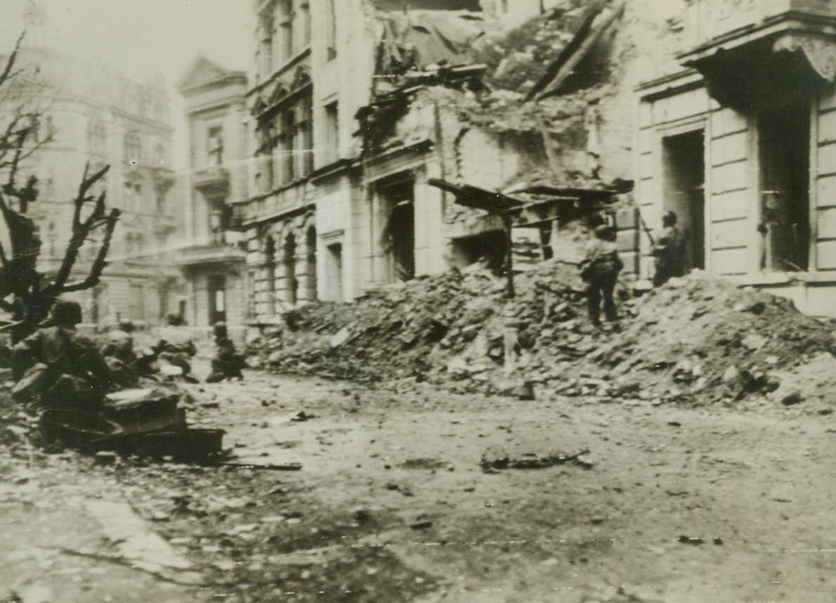Sniper Hunt in Aachen, 10/17/1944. Making their way over the rubble-strewn streets of this blasted city in Germany, U.S. Infantrymen search out sniper nests of Nazis trapped in the ruins. Credit Line (Army Radiotelephoto from ACME);