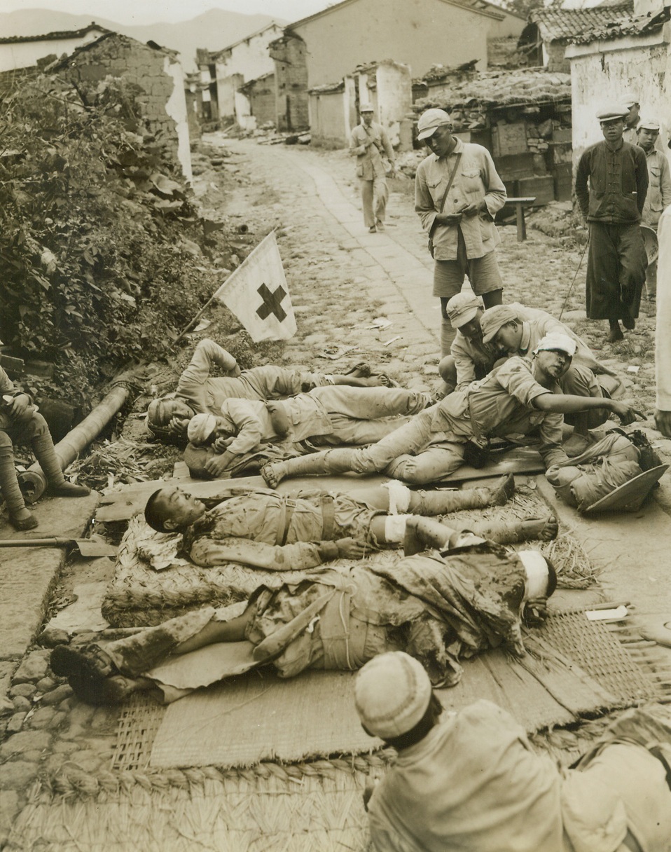 The Bloody Siege Of Tengchung, 10/4/1944. Badly wounded Chinese troops are treated at a makeshift first aid station in Tengchung.  The American-trained force suffered heavy casualities in the desperately slow battle.  Credit Line –WP--(ACME);