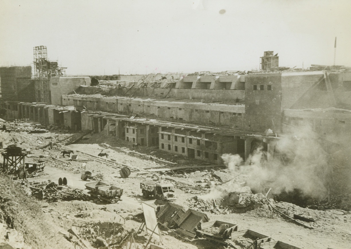 BREST FORTRESS BURNS AFTER CAPTURE, 10/7/1944. FRANCE – Fort Montbarey in the French port of Brest burns after its capture by the Allies on September 17.  Germans withstood a long allied siege before surrendering.  All weapons were destroyed by the Nazi demolition squads before final capture.  Tunnels, honey-combed beneath the Fort aided the Nazis to resist superior Allied forces.  Fort itself shows results of terrific artillery bombardment.Credit: Acme;
