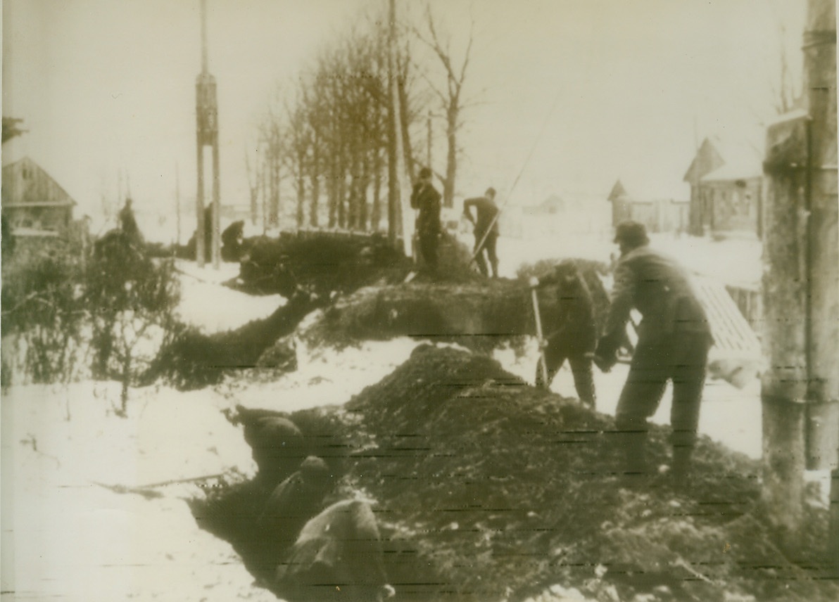 Nazis Dig in on North Russia Front, 2/8/1944. Russia – German soldiers hastily construct trenches on the northern Russian front in an area named in the German caption as “south of Nevel.” This is the sector where the Reds have renewed their offensive and taken more than 80 localities in attacks which may form the southern prong of a great pincers, the northern arm sweeping through the Leningrad territory. (Photo flashed from Stockholm to N.Y. today) Credit: (ACME Radiophoto);