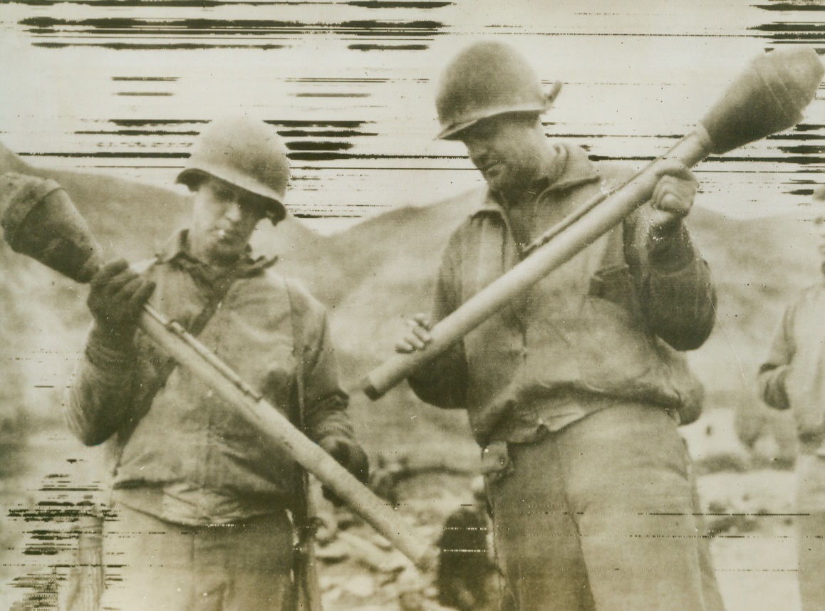 German Bazookas, 2/9/1944. CASSINO, ITALY – Two Yanks examine the Nazi version of the bazooka gun, captured on the outskirts of Cassino by members of the Allied Fifth Army. Left to right: Pfc Carl Swenson of Austin, Minn., and Cpl Dean Alexander of Oklahoma City, Okla. Credit Line (OWI Radiophoto from Acme);