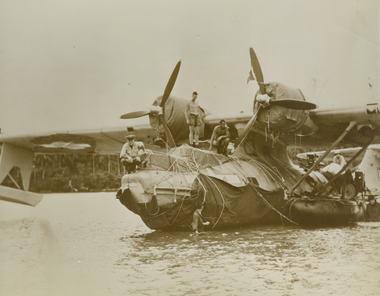 The Seabees Saved Her, 2/6/1944. New Georgia Island – Abandoned as lost when it struck a hidden reef off New Georgia Island in the Solomons, this $250,000 Navy Catalina was salvaged by the Seabees.  The construction battalion men lashed tarpaulin around the hull to cover holes in the ship and, using rubber rafts as pontoons, they floated the big ship ashore.Credit line (Official U.S. Navy photo from ACME);