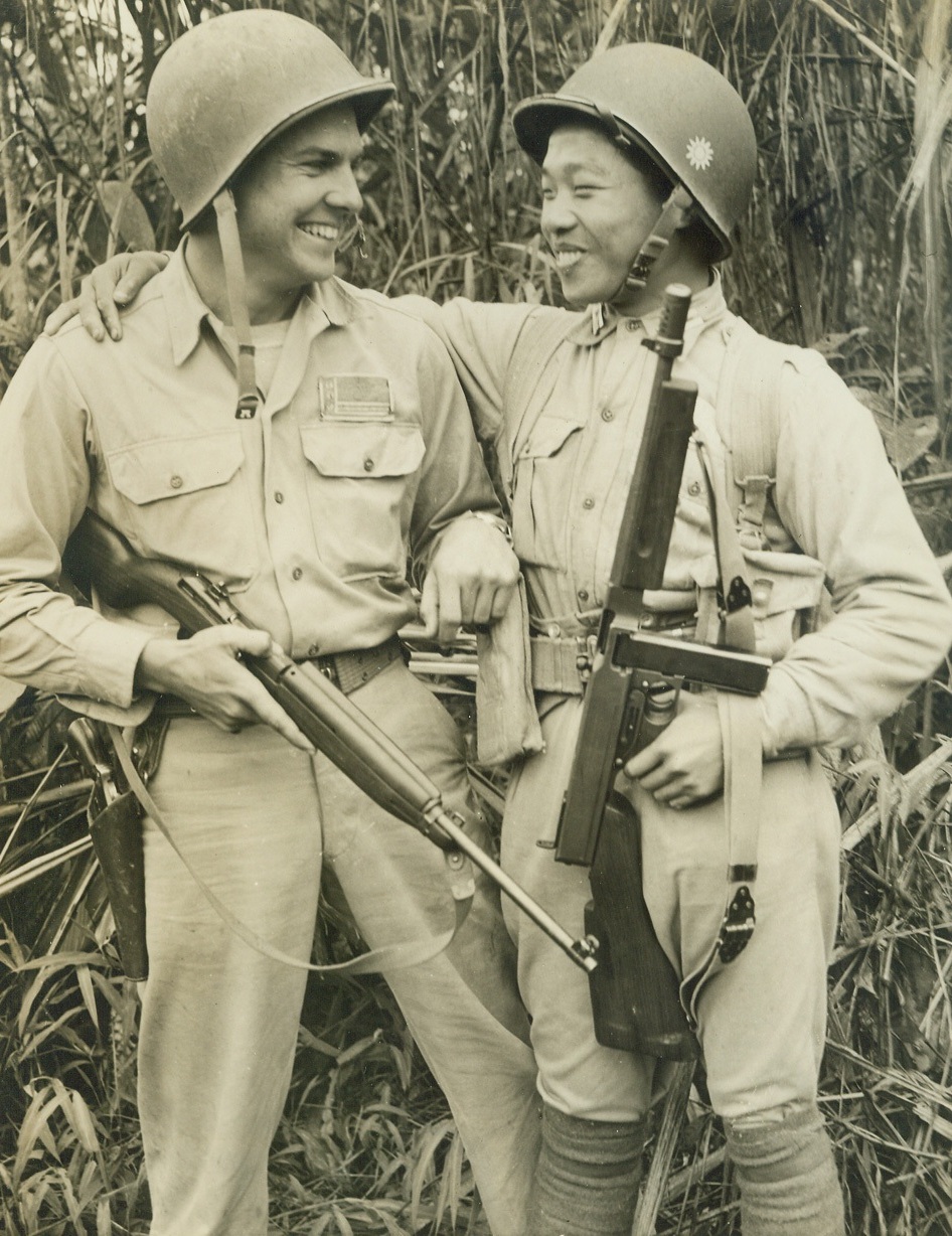 Wants to "Get it Over", 2/28/1944. ASSAM -- Sgt. William H. Hancock (left) USA, of Rockhill, S.C., was given a chance to go home on leave after serving two years in the CBI Theater, under the new policy which gives a man a furlough after two years service. But the Sergeant turned down the chance, even though he was anxious to get home, because he wants to stay and get the war over. A Chinese pal is shown with Hancock. Credit: (ACME Photo by Frank Cancellare for the War Picture Pool);