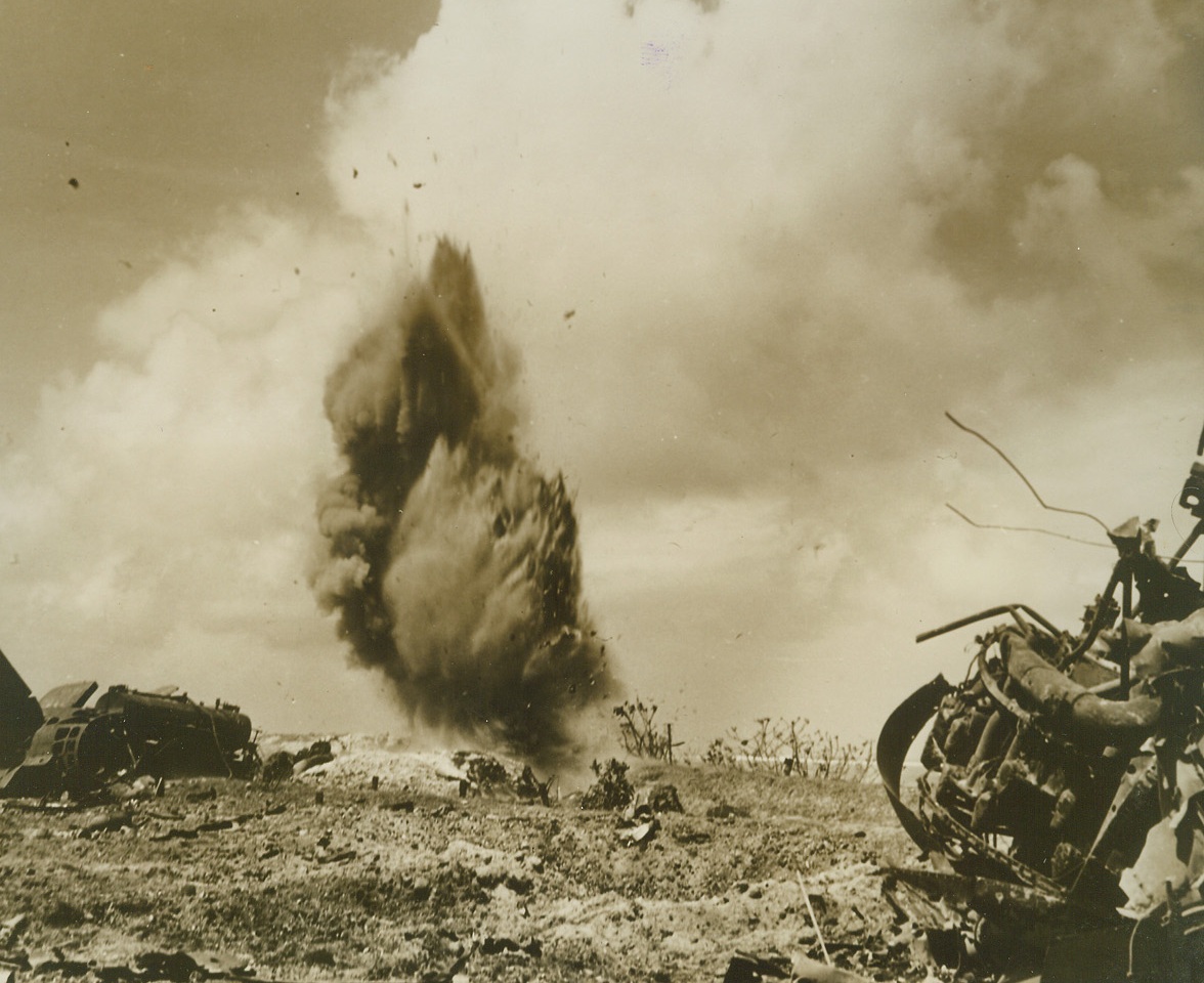 Funeral Pyre for Jap Riflemen, 2/26/1944. Marshall Islands – A towering geyser of smoke and debris marks the extinction of a number of Japanese riflemen who were blown up along with their fortified dugout by U.S. Marine “detonation squads” during the advance over Kwajalein Atoll in the Marshalls on February 1.Credit (Official U.S. Navy photo from ACME);