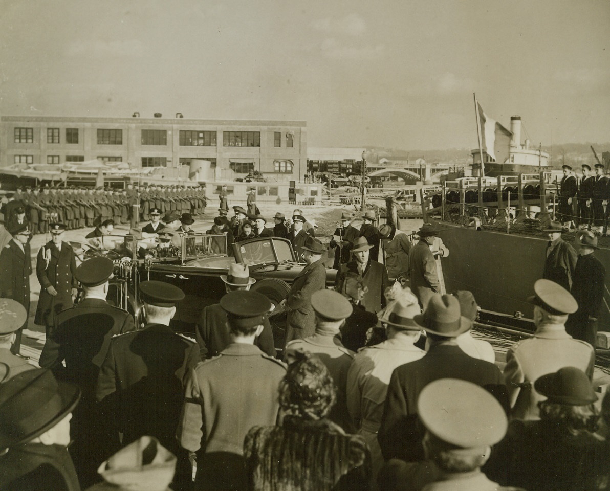 FDR Presents French Navy With New DE, 2/13/1944. Washington, D.C.—The destroyer-escort “Senegalais” flies the French Tricolor (stern in background) after being presented by President Roosevelt as Commander-in-Chief of the Armed Forces, to the French Navy. French and U.S. soldiers stand at attention during the colorful ceremony. The President’s car is in the foreground. Credit: ACME.;