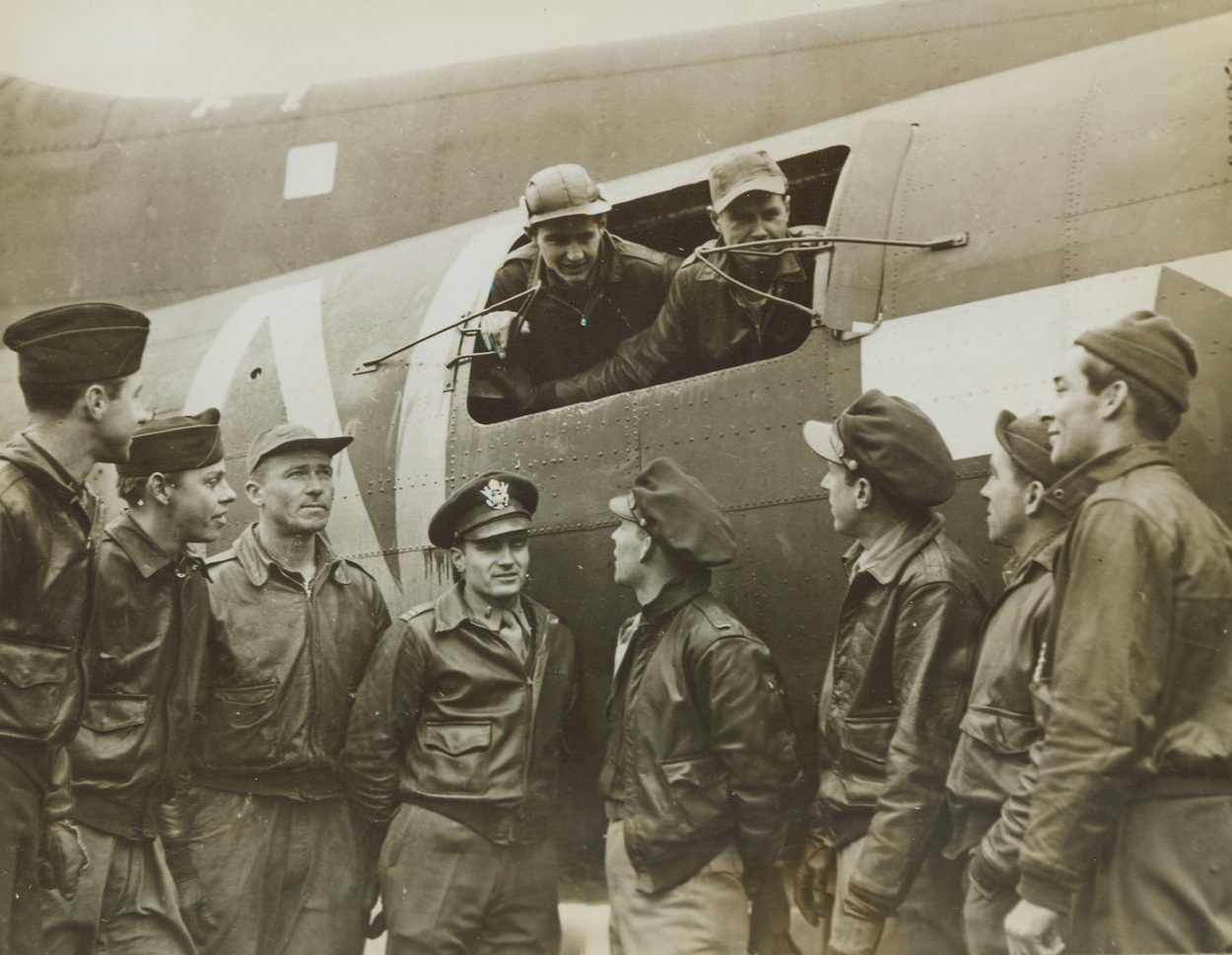 They Got Home!, 2/20/1944. England - These boys had to jettison everything, including the Ball Turret, to get their Flying Fortress home after two engines had been knocked out by flak during a raid over Frankfort. Left to right: 2nd Lt. William C. Johnson, pilot, of Lewis Chapel, Tenn.; Ball Turret Gunner Sgt. David E. Cameron, Boothwin, PA; Radio Operator S/Sgt Ruben Kisner, Doylestown, PA; Bombardier 2nd Lt. James P. Cain, Barnum, IA; Navigator 2nd Lt. William C. Gray, Wilkes Boro, N.C.; Co-Pilot 2nd Lt. Matt Farmer, Mankato, Minn.; Tail Gunner Sgt. Ed. J. Skiba, Aliquippa, PA; Top Turret Gunner S/Sgt Robert D. Cavanaugh, San Antonio, Texas; (and in window) Right Waist Gunner Sgt. Raymond G. Calvert, Detroit, Mich.; and Left Waist Gunner Sgt. Glenn E. Bratcher, Lamesa, Texas. Credit: U.S. Army Air Forces photo via OWI - ACME;