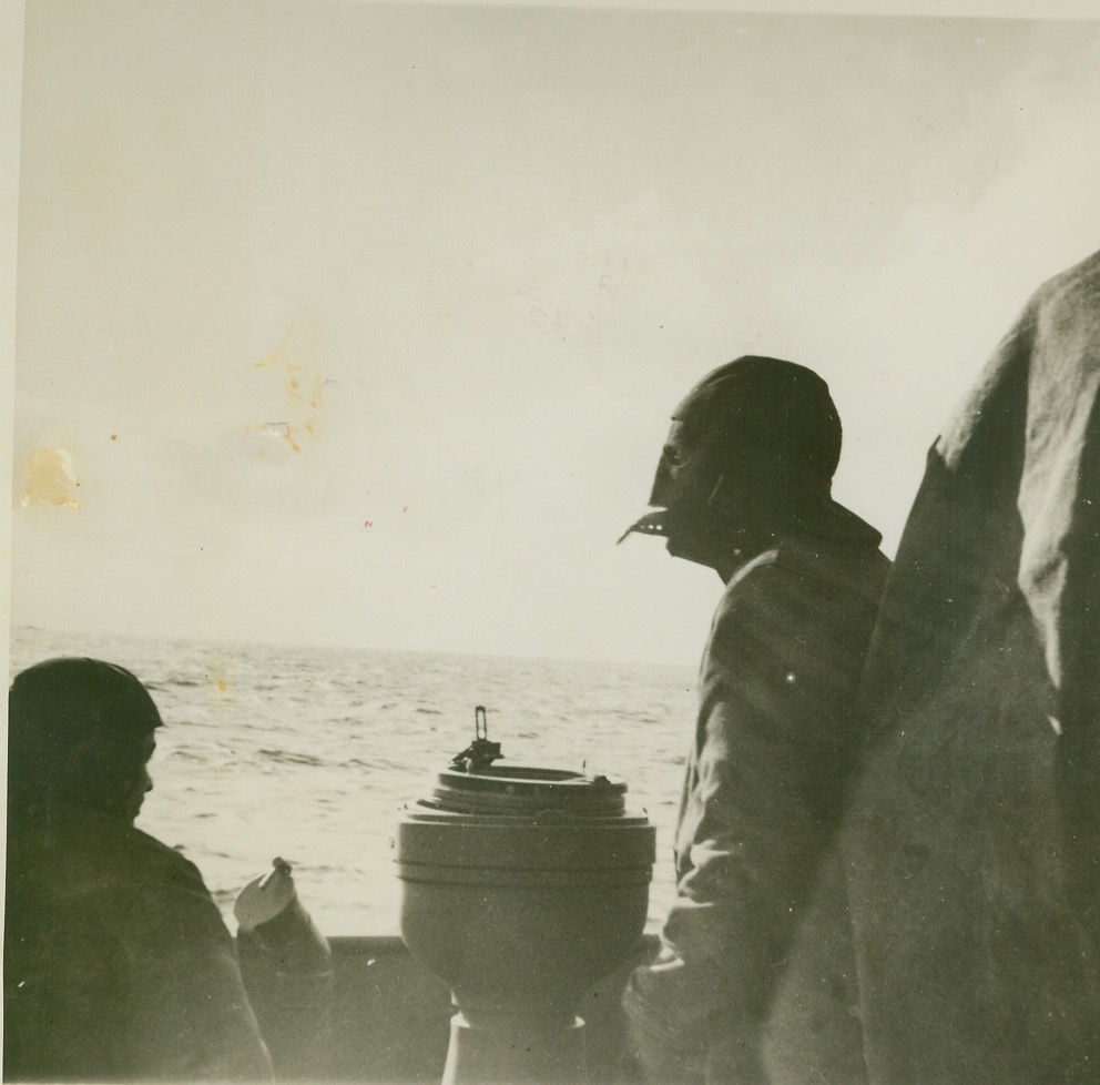 JAPAN, HO!, 3/2/1944. SOMEWHERE IN THE PACIFIC – Lookouts of a U.S. Naval Task Force which shelled Japan’s big base at Paramushiro in the northern Jkuriles early in February wear face masks for protection against biting wind and icy spray as the force steamed on its way. It may have been this lookout who first sighted the Nipponese mainland. Credit: ACME;