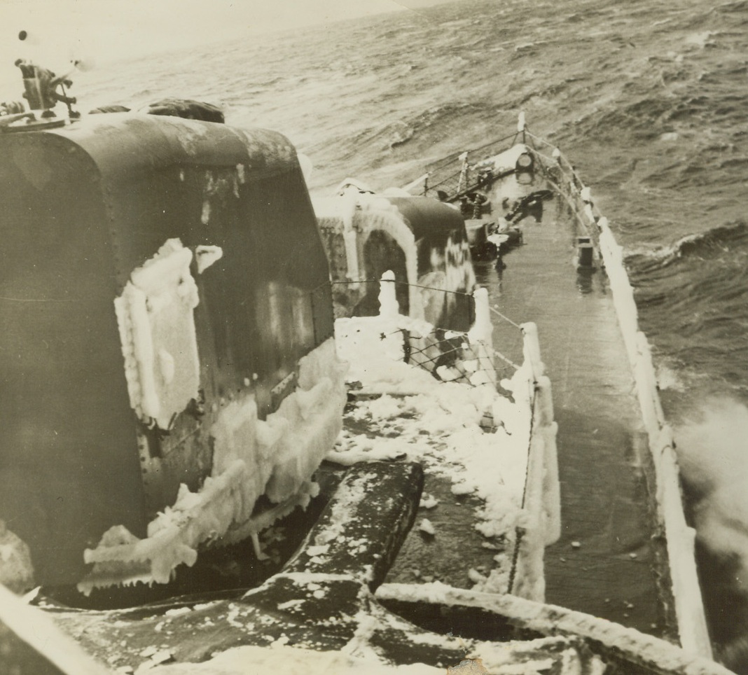 Cold Work, 3/2/1944. Somewhere in the Pacific – Ice forms along the decks and rails of the U.S. Task Force ships which shelled Paramushiro, Japanese Naval Base in the Northern Kurile Islands early in February. The raid marked the first time American Warships had come so close to Japanese home territory since the outbreak of war. Shore installations and a merchant vessel were damaged. The Task Force escaped unharmed. Credit: ACME;