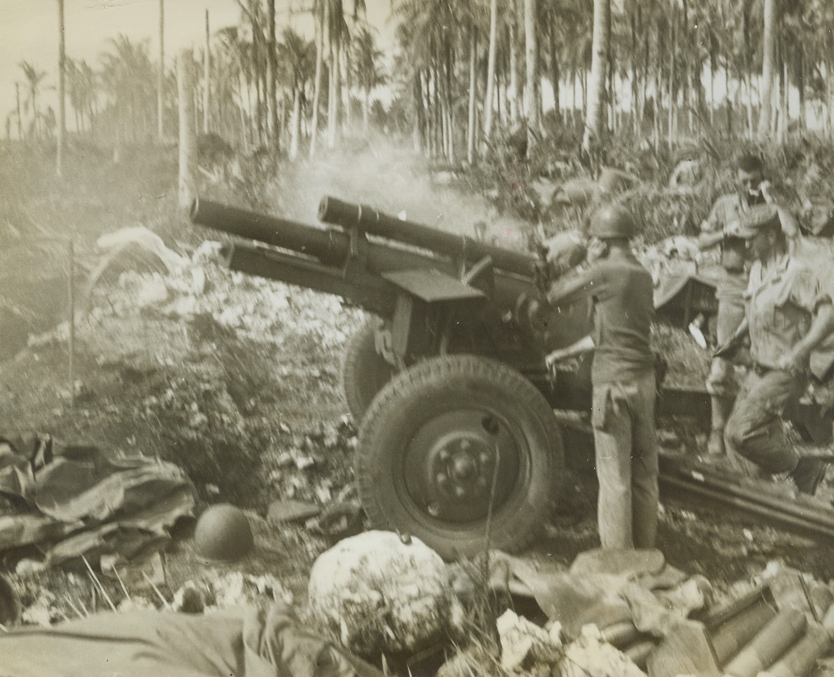 Cleaning ‘Em Up, 3/23/1944. Los Negros, Admiralty Islands – An Allied 150mm gun dishes out plenty of trouble for Japanese troops remaining on Los Negros Island after Yanks had conquered most of the isle. The gun station is in the heart of a battered coconut grove that was blasted by air and sea forces before ground troops landed. Credit: ACME photo by Frank Prist, Jr., for the War Picture Pool;