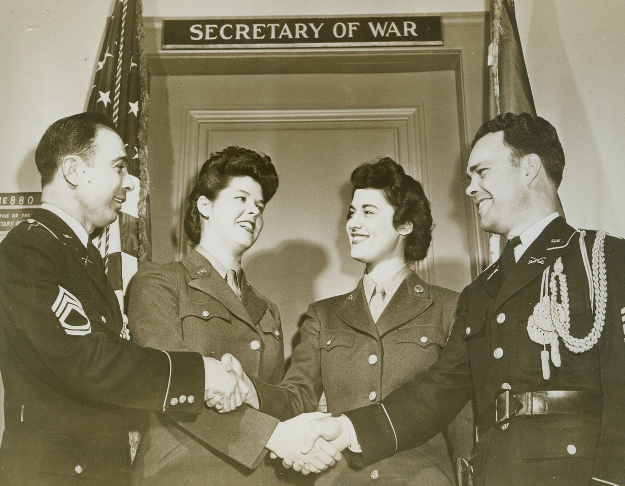 New Aides to Secretary of War, 3/28/1944. Washington, D.C.-The War Department announced that WACs have replaced men as enlisted aides to the Secretary of War at his office in the Pentagon building here. Photo shows, left to right, as new aides in front of Secretary’s office, come to take over: Sgt. Michael Altier, of Easton, Pa.; Pvt. Betty R. Cameron, of Ft. Collins, Colo.; Pvt. Marie H. Santoli, of Brooklyn, NY; and Sgt. Cecil Combs, of Portland, Ore. Credit: ACME.;