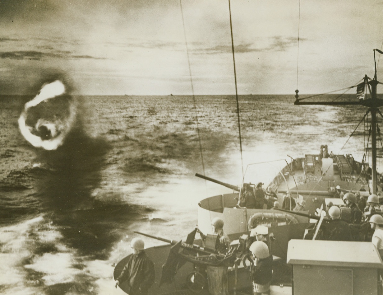 COAST GUARD GUN BLOWS SMOKE RING, 3/29/1944. IN THE NORTH ATLANTIC – Battle practice proves pleasurable for the Coast Guard gunners when their guns cut capers such as this huge smoke ring ejected from the mouth of a three-incher.  Frequent drills while on convoy and patrol duty, keep the Coast Guard on the alert for battle.Credit: US Coast Guard photo from Acme;